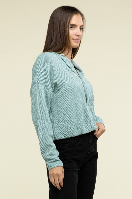 
                      
                        Textured Line Elastic Waist Pullover Top
                      
                    