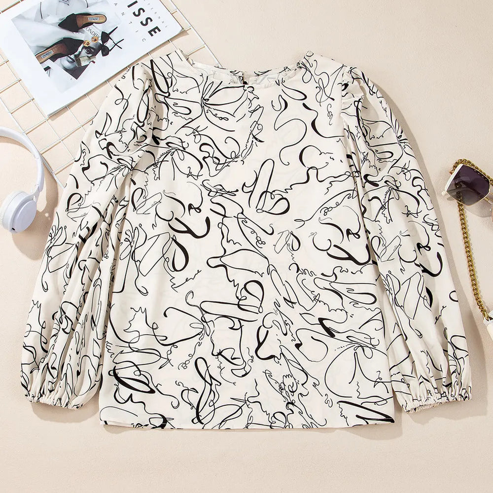 
                      
                        Printed Round Neck Three-Quarter Sleeve Blouse
                      
                    