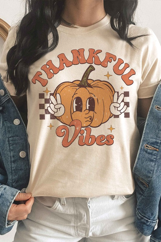 
                      
                        THANKFUL VIBES CHECKER PUMPKIN Graphic Tee
                      
                    