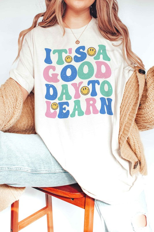 
                      
                        IT'S A GOOD DAY TO LEARN HAPPY FACE GRAPHIC TEE
                      
                    