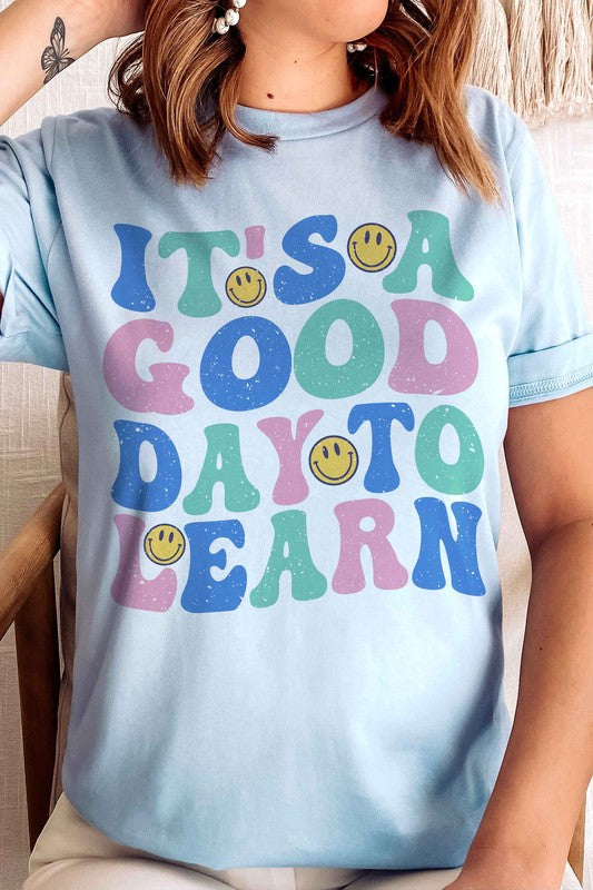 
                      
                        IT'S A GOOD DAY TO LEARN HAPPY FACE GRAPHIC TEE
                      
                    