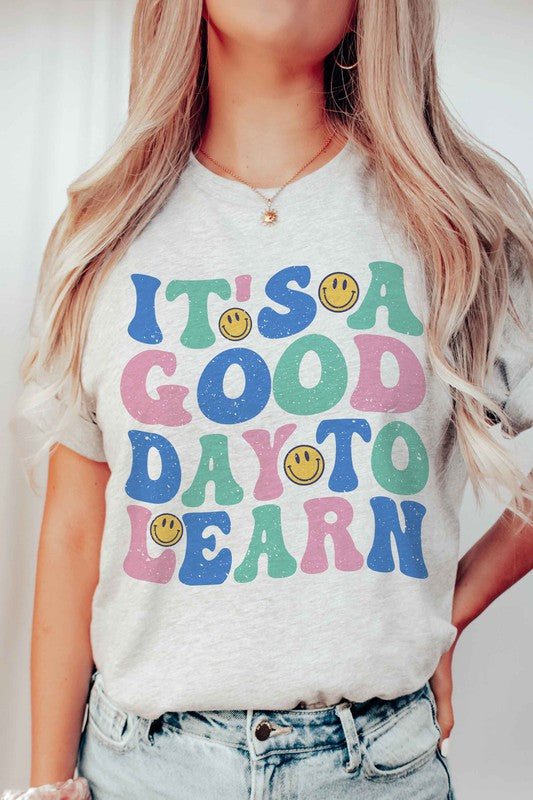 
                      
                        IT'S A GOOD DAY TO LEARN HAPPY FACE GRAPHIC TEE
                      
                    