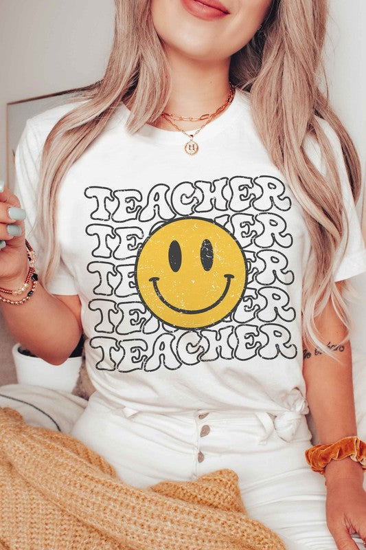 
                      
                        HAPPY FACE TEACHER REPEAT GRAPHIC TEE
                      
                    