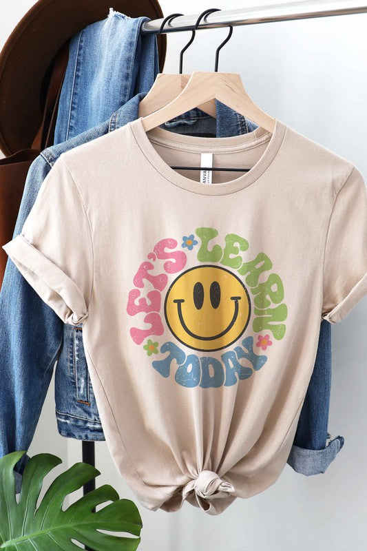 
                      
                        LET'S LEARN TODAY HAPPY FACE Graphic Tee
                      
                    