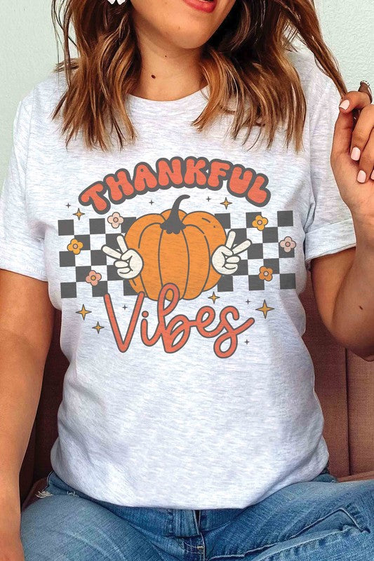 
                      
                        CHECKER THANKFUL VIBES PUMPKIN GRAPHIC TEE
                      
                    