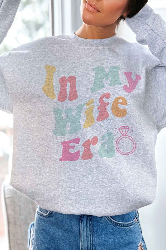 
                      
                        IN MY WIFE ERA Graphic Sweatshirt
                      
                    