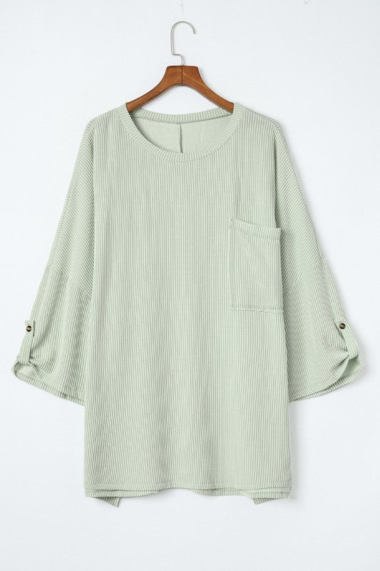 
                      
                        Ribbed tab sleeve oversize pocket top
                      
                    