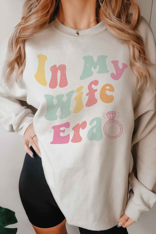 
                      
                        IN MY WIFE ERA Graphic Sweatshirt
                      
                    