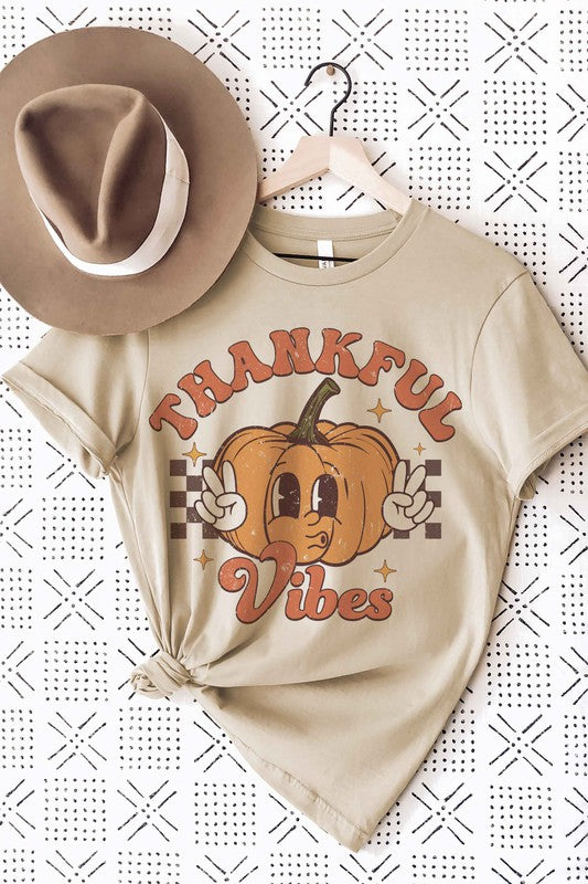 
                      
                        THANKFUL VIBES CHECKER PUMPKIN Graphic Tee
                      
                    