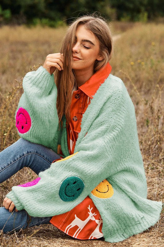 
                      
                        The Fuzzy Smile Long Bell Sleeve Knit Cardigan
                      
                    