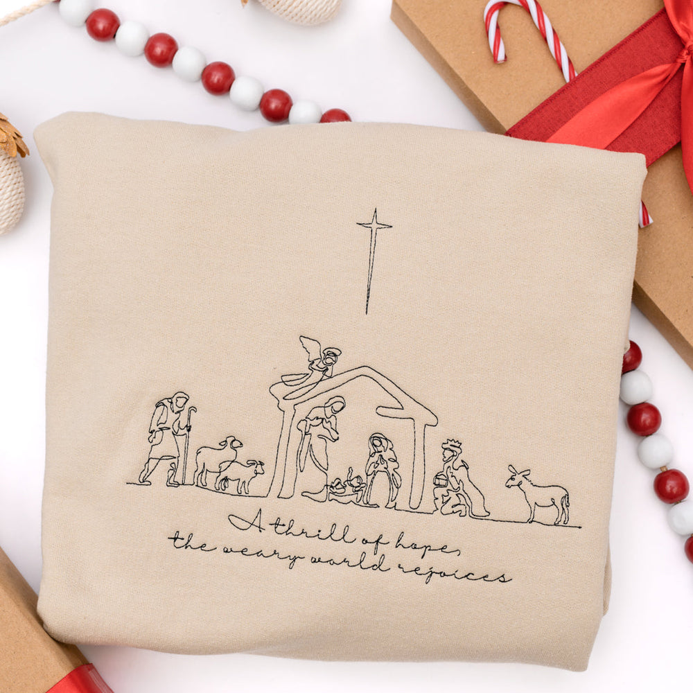 
                      
                        PREORDER: A Thrill of Hope Embroidered Nativity Sweatshirt
                      
                    