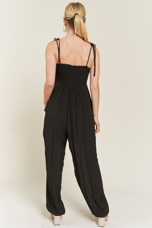 
                      
                        Smocked Tie Strap Jumpsuit
                      
                    