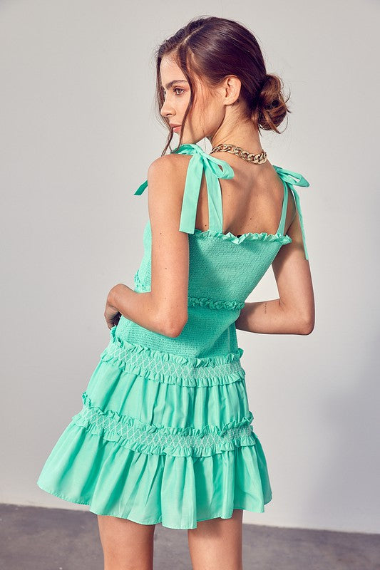 Load image into Gallery viewer, Nina Smocked Bow Tie Tiered Mini Dress
